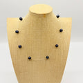Collier perles noires sur câble